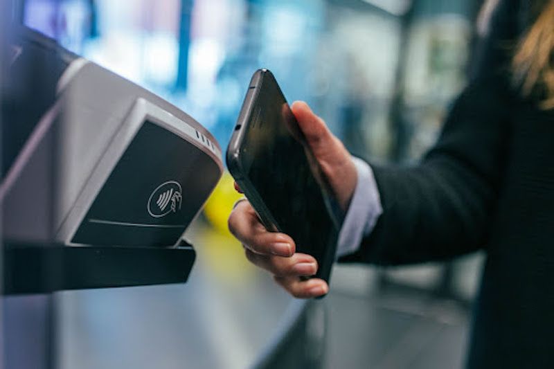 Person making contactless payment